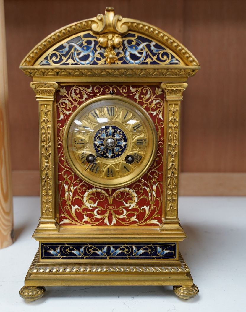 A late 19th century French champlevé enamel mantel clock, 22cm. Condition - good but with wear to dial, not tested as working